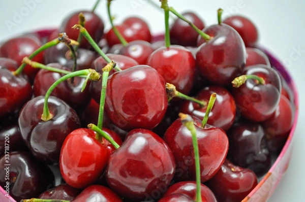 Fototapeta Pile of fresh red cherries with stems