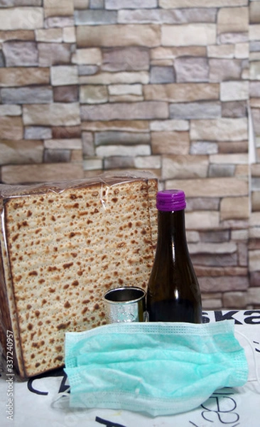 Obraz Corona Passover. Dust mask, bottle of wine and matzah - a traditional Jewish food for Passover