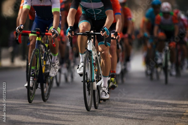 Obraz Group cyclist professional in a race.