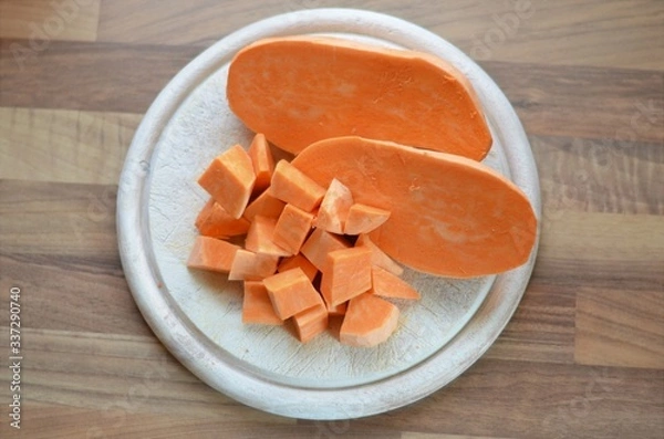 Obraz sweet potatoe on a chopping board