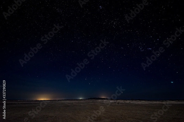 Obraz Gorgeous night image with brilliant stars in the middle of the desert in Masirah island, Oman
