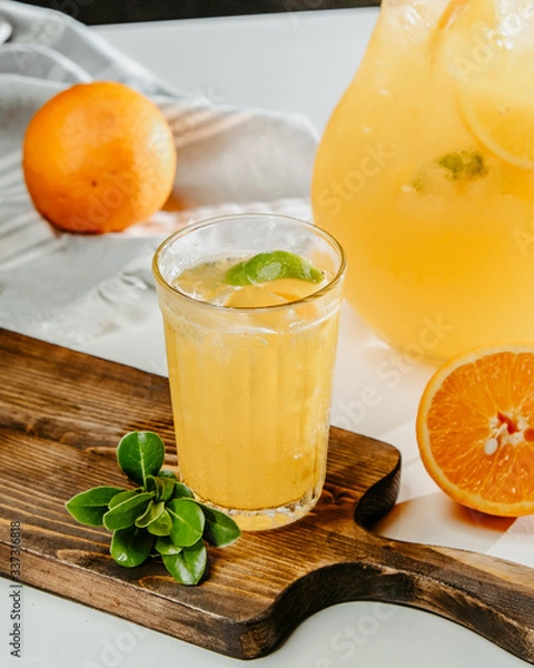 Fototapeta orange and lemon lemonade with ice