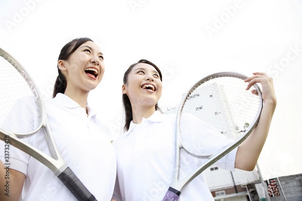 Obraz ラケットを持つ笑顔の女子高校生