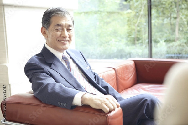 Obraz ソファに座る社長