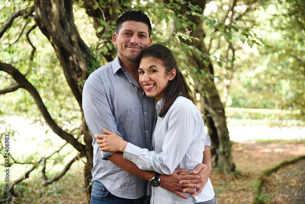 Fototapeta Good Looking Couple Hugging in a Park