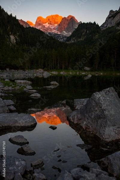Obraz The Dachstein with a reflection at the Gosausee during sunset