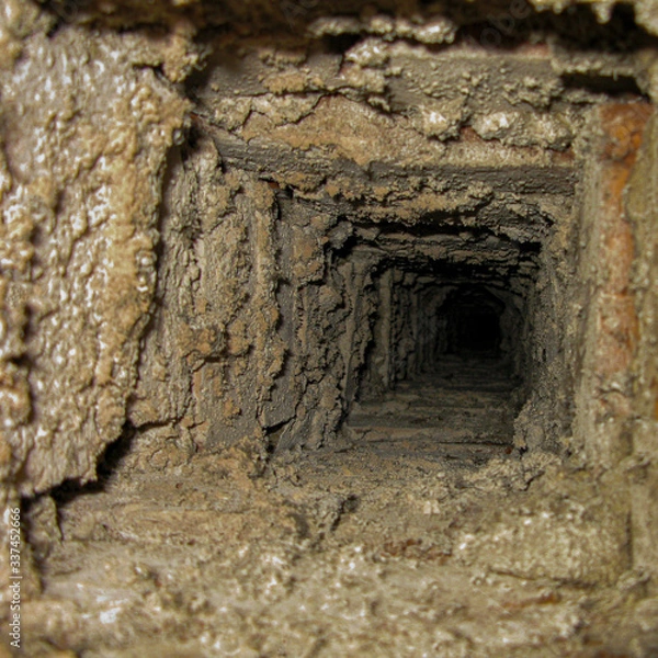Fototapeta Old abandoned mine. Mystical dungeon. Journey through the underground catacombs and tunnels.