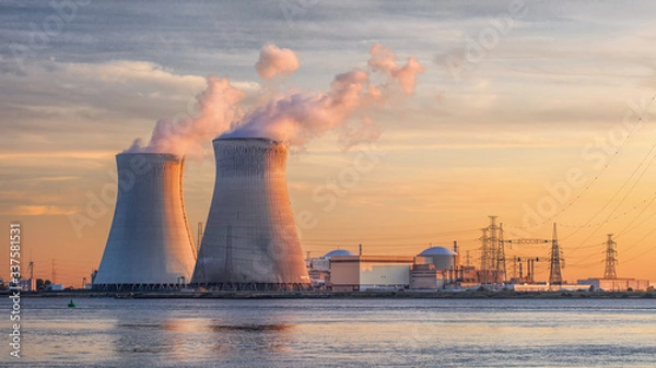 Obraz Late afternoon scene with view on riverbank with nuclear reactor Doel, Port of Antwerp, Belgium.