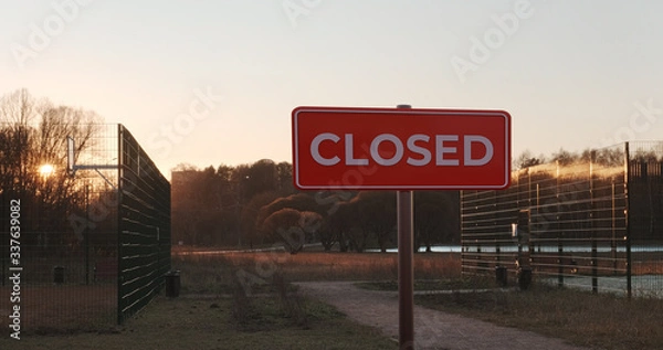 Fototapeta Park with sport fields closed at coronavirus quarantine lockdown. Covid 19 stop and cancel sports and recreation. No entry sign.