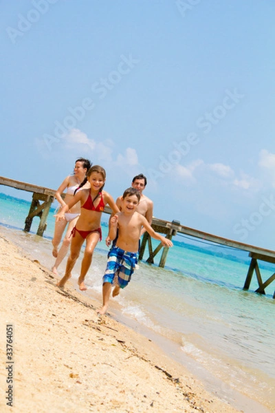 Obraz Family running on the beach