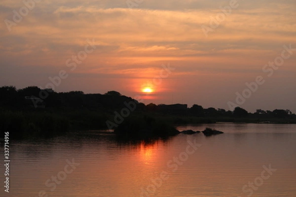 Obraz sunset over the river