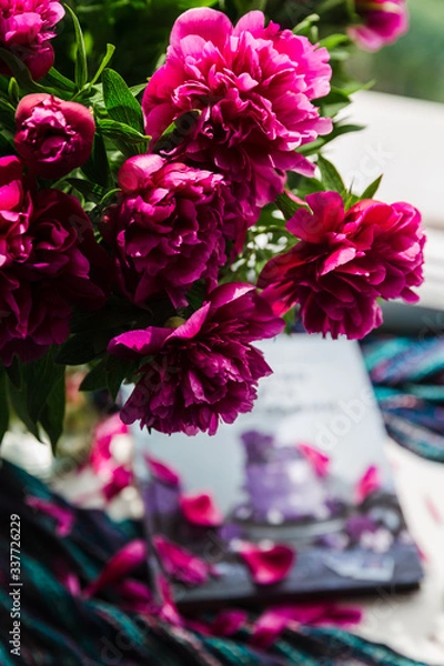 Obraz bouquet of pink peonies. big bouquet of peonies and a book. home decoration idea. spend time home nicely