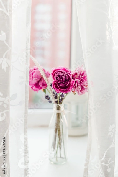Obraz peony wallpaper. peony in a vase on a white background. simple and abstract flower background. close up of pink flowers in vase. white picture of a pink peony bouquet