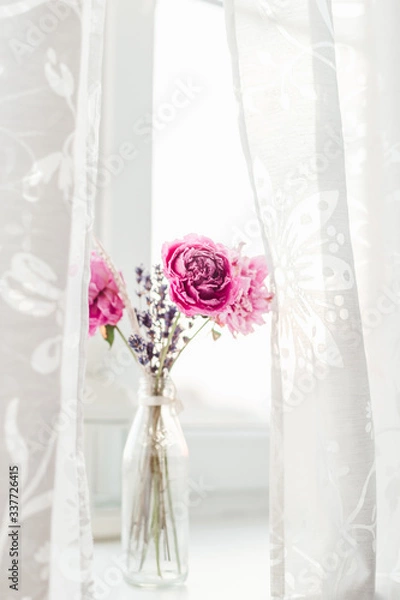 Obraz white peony wallpaper. peony in a vase on a white background. simple and abstract flower background. close up of pink flowers in vase
