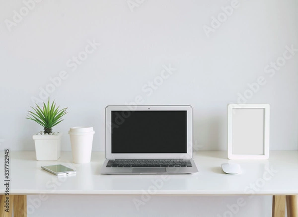 Fototapeta modern lap top template mock up on white and clean work desk with blank screen