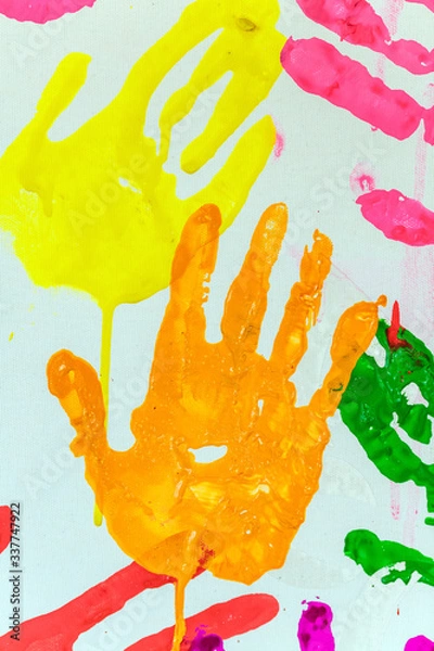 Fototapeta Colorful painted hand prints on white background