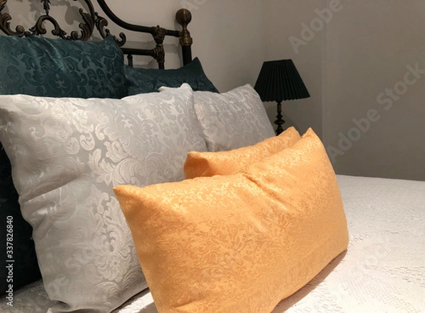 Obraz luxurious wrought iron bed with silk pillows