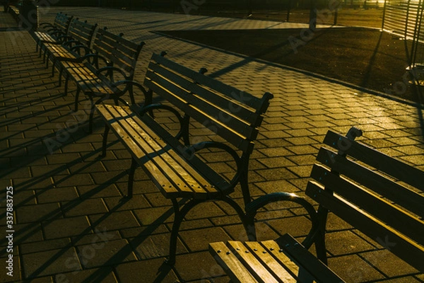 Obraz Empty benches on an isolated park