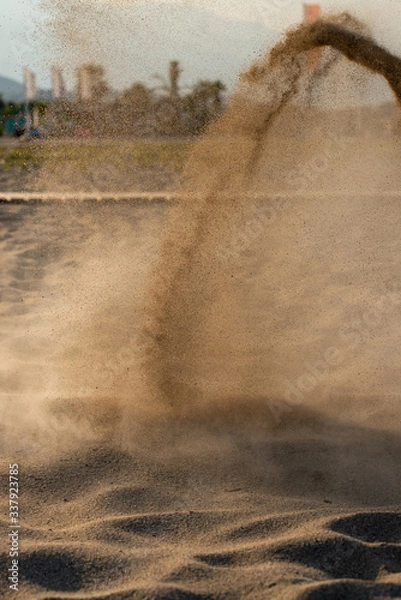 Fototapeta Sand storm, forming a scenery with fountain of sand