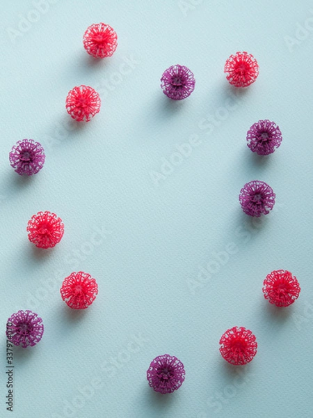 Obraz Coronavirus models on neutral background with copy space