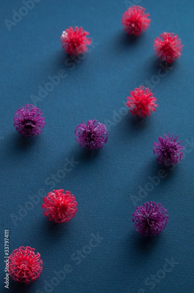 Fototapeta Coronavirus models on neutral background with copy space