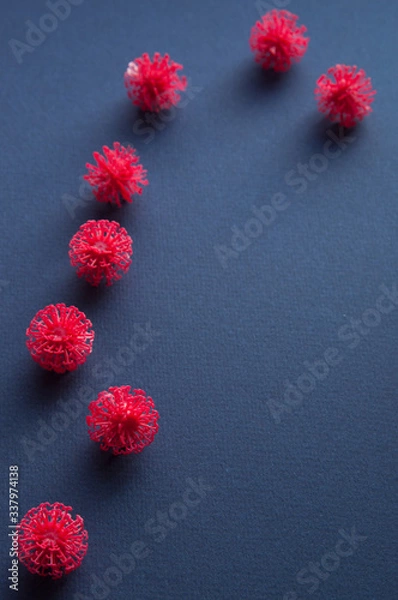 Obraz Coronavirus models on neutral background with copy space