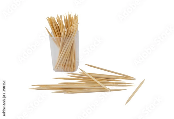 Obraz Wooden toothpicks in plastic bottle and scattering on white background. Isolated photo
