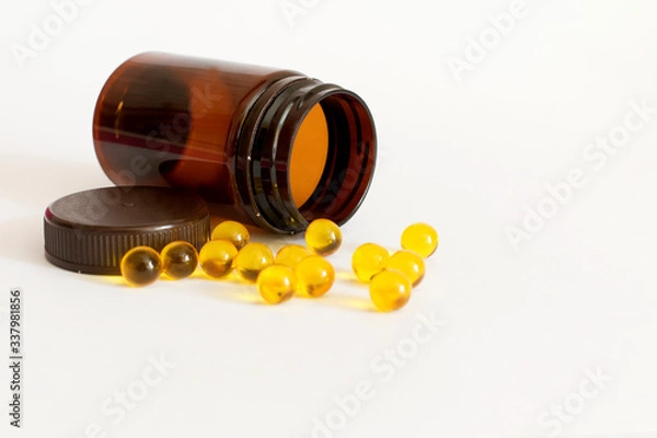 Obraz pills and vitamins on a white background
