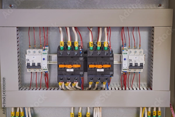 Fototapeta Two contactors or magnetic starters with mechanical locking, two circuit breakers and two phase control relays in the electrical Cabinet. Automatic input of the power reserve.