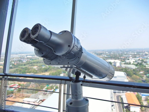 Fototapeta Large binoculars can be used for viewing views on tall buildings.