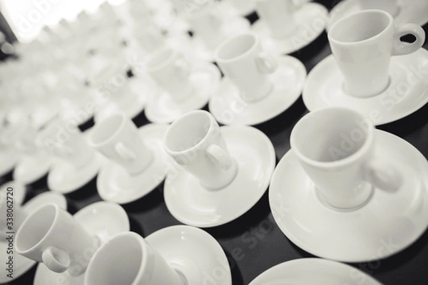 Obraz Coffee cups aligned on a table