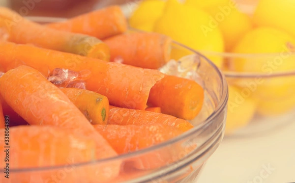 Fototapeta Fresh carrots for preparation of juice.