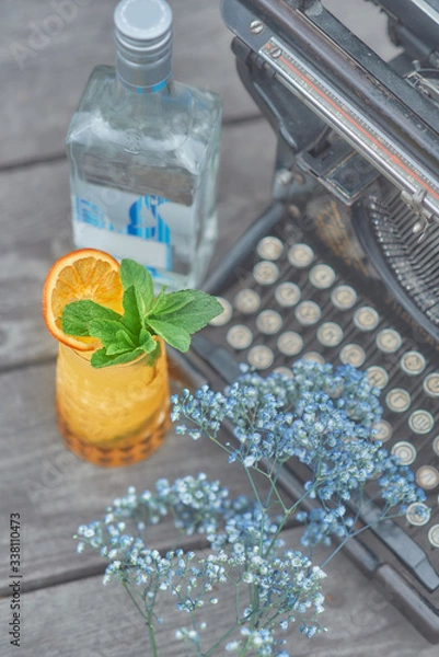 Obraz alcoholic cocktail with fruits on an old wooden table