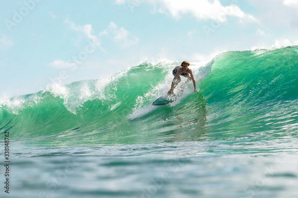 Obraz Boy surfing in sea