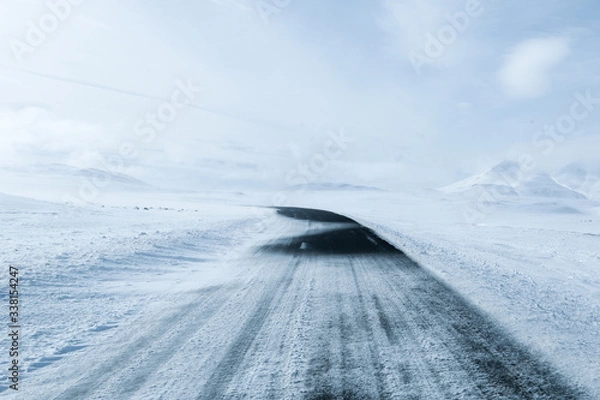 Obraz View of snow covered road in winter