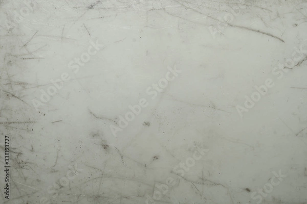 Fototapeta Scratched plastic texture. dirty gray surface background