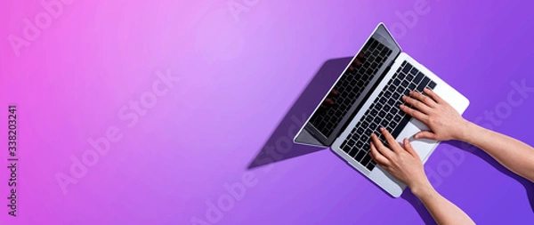 Obraz Person using a laptop computer from above