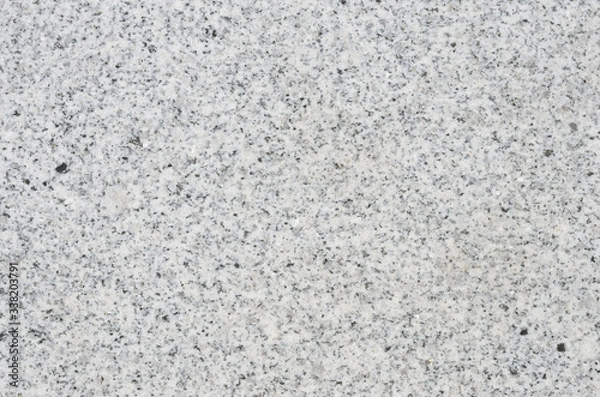 Fototapeta The texture of the treated granite surface. Building and finishing material.