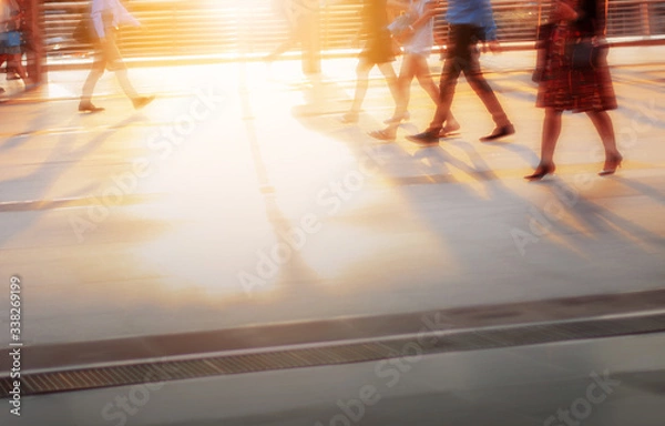 Obraz People are walking with sunset.