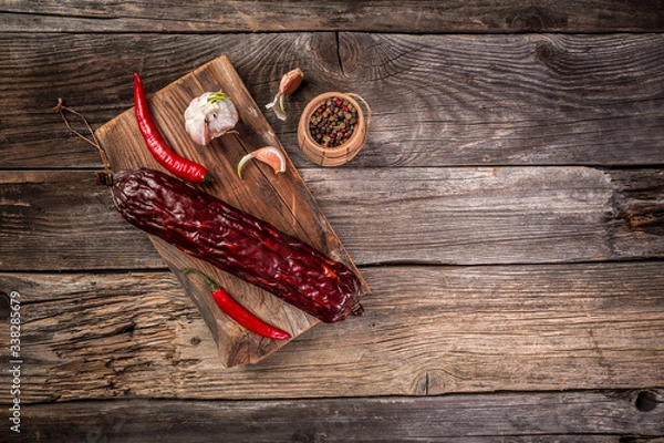Fototapeta Variety of dry cured Spanish pork chorizo sausages made with paprika and garlic. Dried organic salami sausage. menu banner space for text