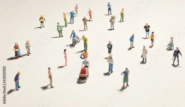 Fototapeta Top view of people (miniature toys) with long shadows keep distance away in public during sunrise or sunset.Social distancing / COVID-19 coronavirus outbreak spreading concept.