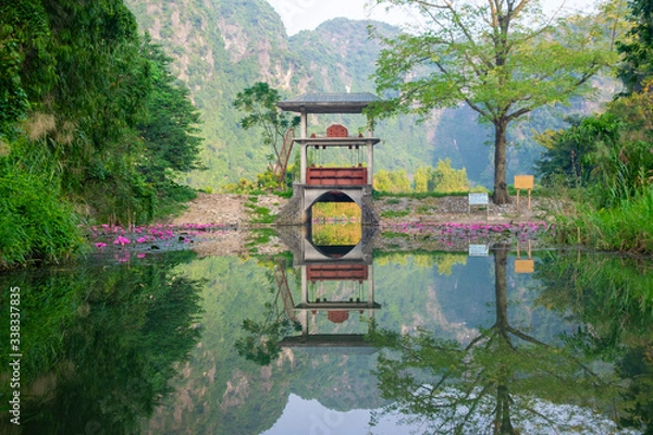 Fototapeta Picture perfect peaceful reflection in the water somewhere in Vietnam.