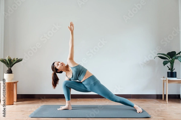 Fototapeta young asian beauty woman doing yoga at home