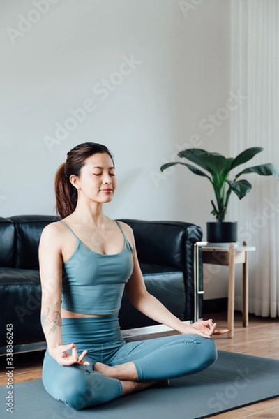 Fototapeta young asian beauty woman doing yoga at home