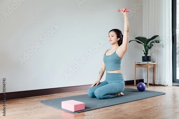 Fototapeta young asian beauty woman doing yoga at home