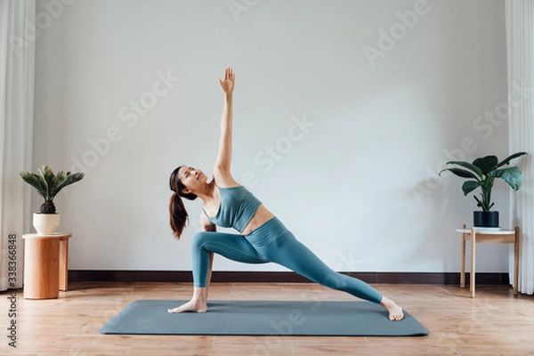 Fototapeta young asian beauty woman doing yoga at home