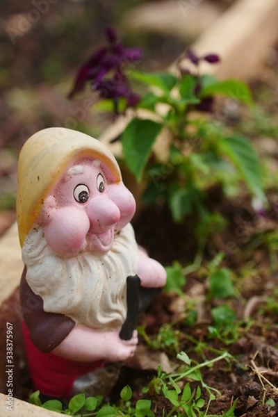 Obraz Cute garden dwarf. Garden decoration.