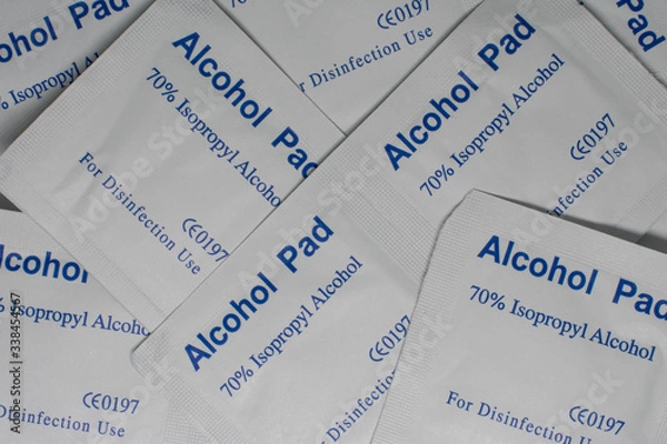Fototapeta Multiple packets of alcohol disinfectant pads, an out of stock item during the Coronavirus epidemic