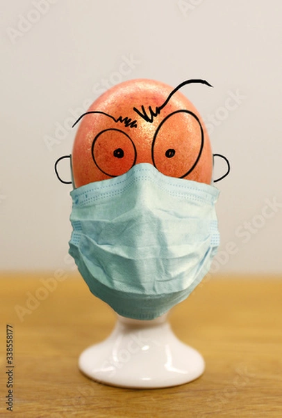 Fototapeta funny easter egg with covid mask