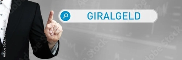 Fototapeta Giralgeld. Mann im Anzug zeigt mit dem Finger auf ein Suchfeld. Das Wort Giralgeld steht in der Suche. Symbol für Business, Finanzen, Statistik, Analyse, Wirtschaft